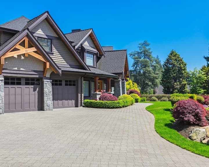 A gorgeous home with well-landscaped exterior designed and constructed by professional custom home builders.